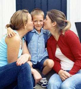 Two moms with young son